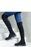 Bottes cuissardes élégantes modernes à zip latéral en daim noir ajustées silhouette rond pointe femmes