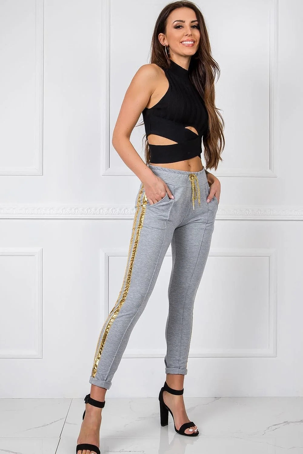 Pantalon survêtement femme style décontracté bleu marine doré coton élasthanne taille élastiquée poches latérales fuselé moderne