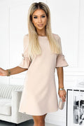 Robe trapèze beige minimaliste manches mi-longs évasées noeuds délicats encolure arrondie coupe droite texture satinée élasthanne confortable semi-formelle