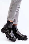 Bottines Chelsea pour femmes en cuir verni noir style moderne et sophistiqué talon bas semelle épaisse crampons maintien cheville confort quotidien