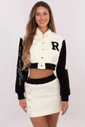 Ensemble varsity pour femme, short ajusté, manches longues, tissu coton polyester, couleurs blanc cassé/noir, finitions métalliques, look sport-chic