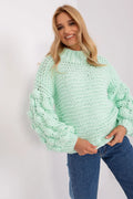 Pull en maille femme couleur pastel manches volumineuses texture tricotée col montant style casual automne hiver