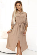 Robe de jour Numoco en tissu fluide beige clair, manches longues, col chemise, ceinture intégrée, poches plaquées, occasions多种