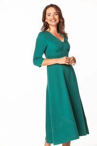 Robe jersey polyester vert émeraude V manches 3/4 coupe droite évasée légèrement ajustable silhouette fluide élégante occasions