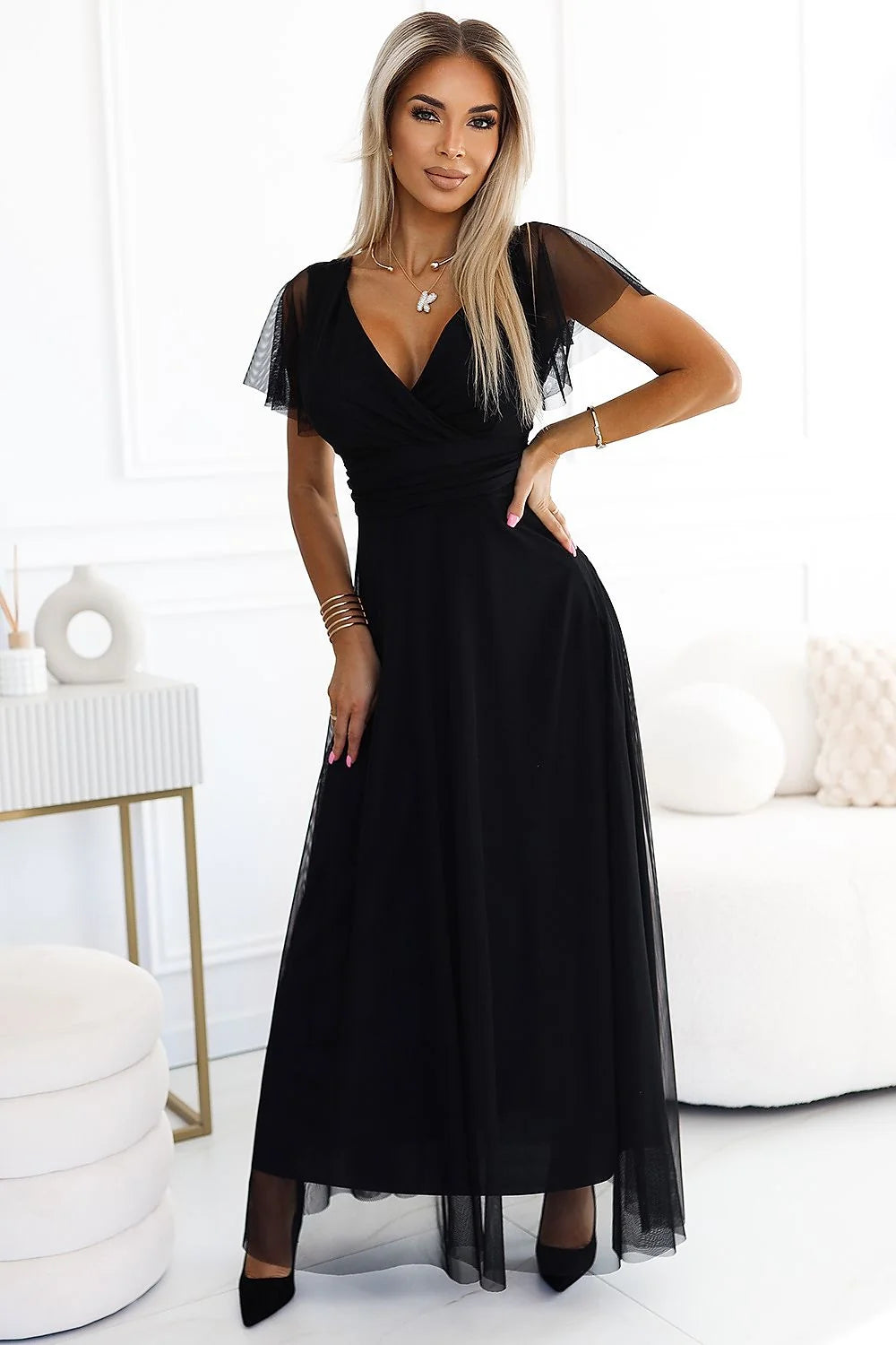 robe longue noire tulle fluide voile transparent décolletéV croisé cachecoeur manches courtes volantes taille marquée ceinture nouée jupe évasée sophistiquée