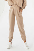 Pantalon jogging femme beige élastique poches latérales avec haut assorti coton élasthanne confortable style décontracté