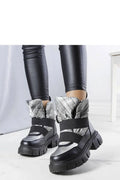Bottes de neige pour femmes, design urbain audacieux, cuir synthétique noir, tissu matelassé argenté, semelle épaisse, fermeture élastique croisée, idéales pour les journées froides, style moderne et fonctionnel