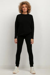 pantalon survêtement Tessita maille douce stretch coton polyester coupe ajustée taille élastique chevilles côtelées minimaliste noir intemporel confortable