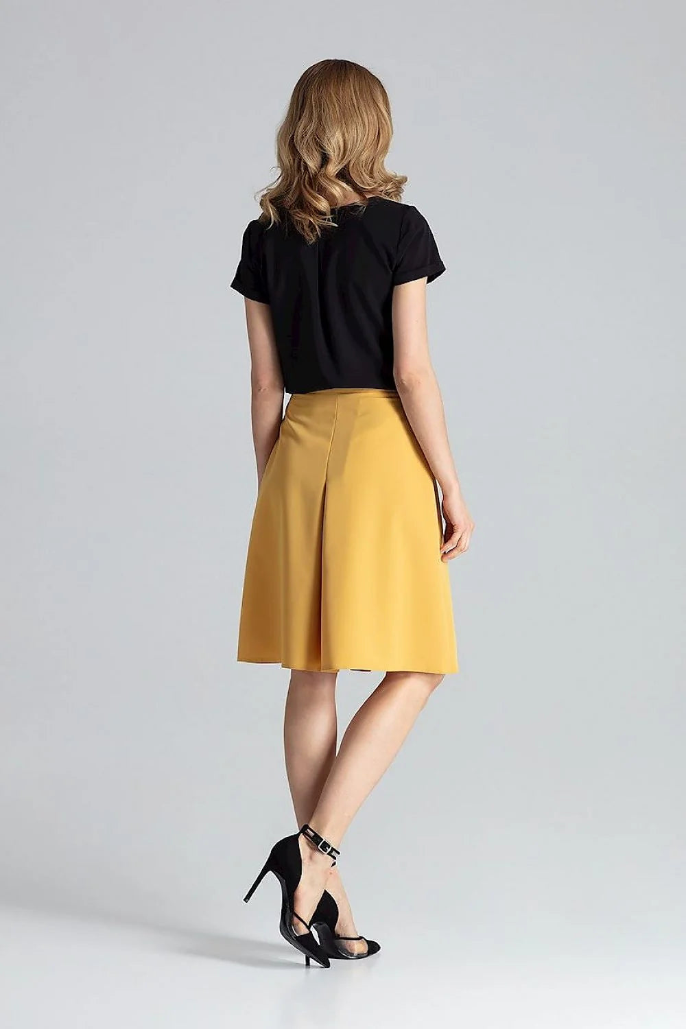 jupe trapèze midi taille haute ajustable mi genou évasée plis contrastés jaune moutarde tissu structuré tombé net élégant contemporain professionnel