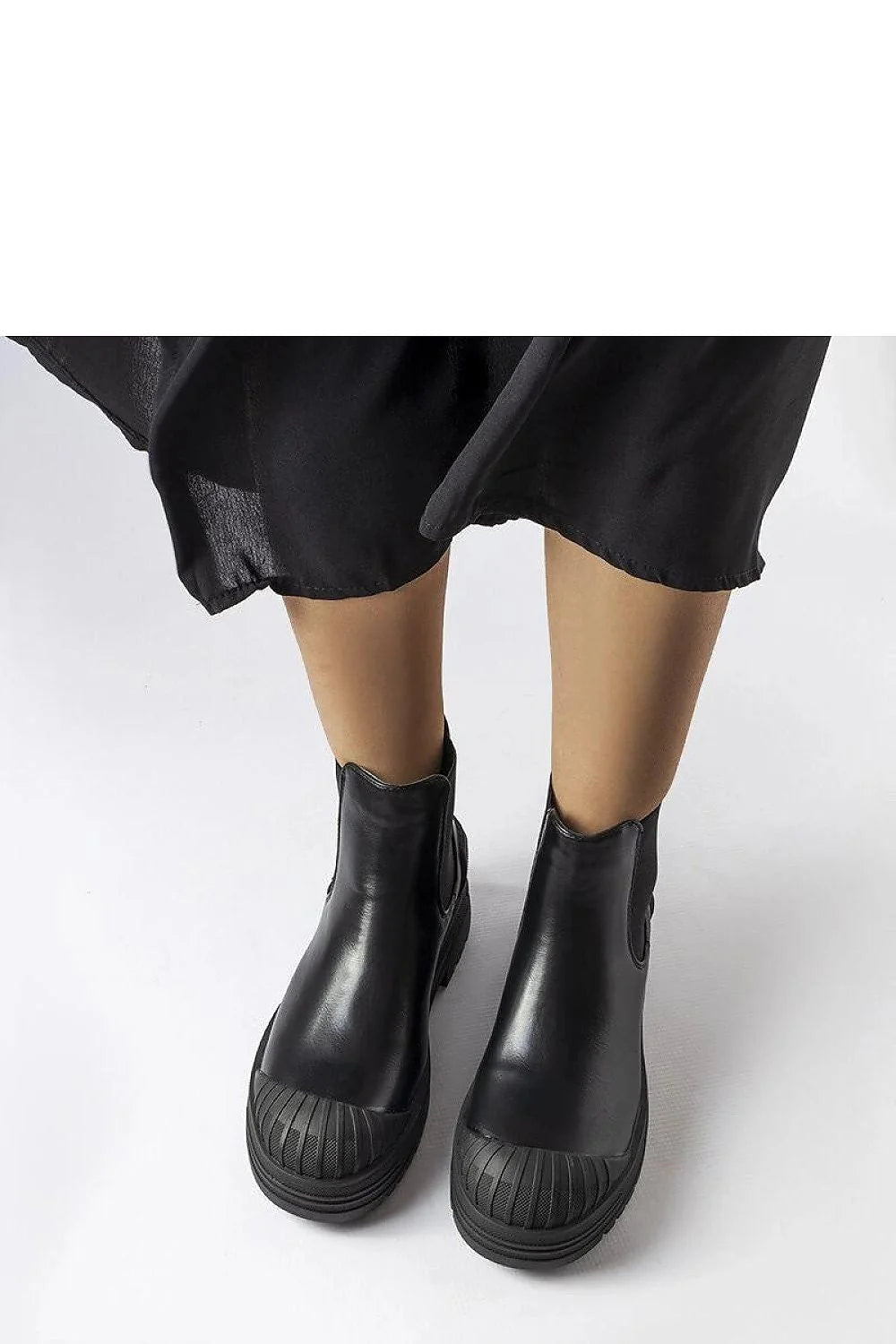 Bottes pour femmes design moderne robuste cuir noir tige haute protection caoutchouc semelle épaisse style Chelsea
