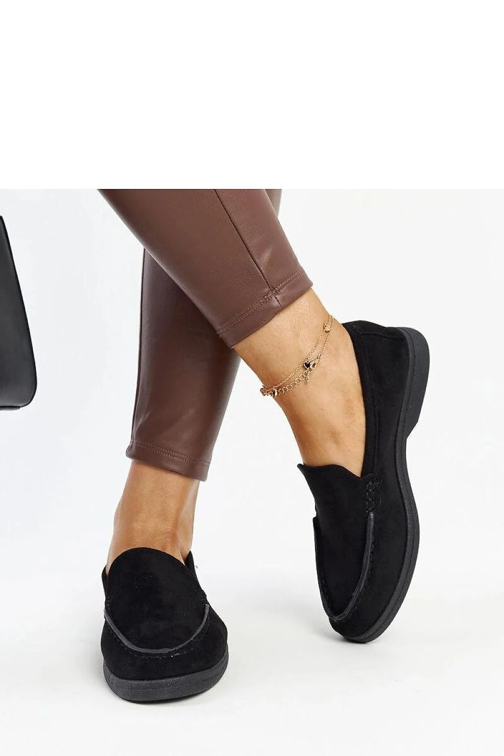 Moccasins élégants pour femmes en daim noir design intemporel confortable talon plat semelle caoutchouc