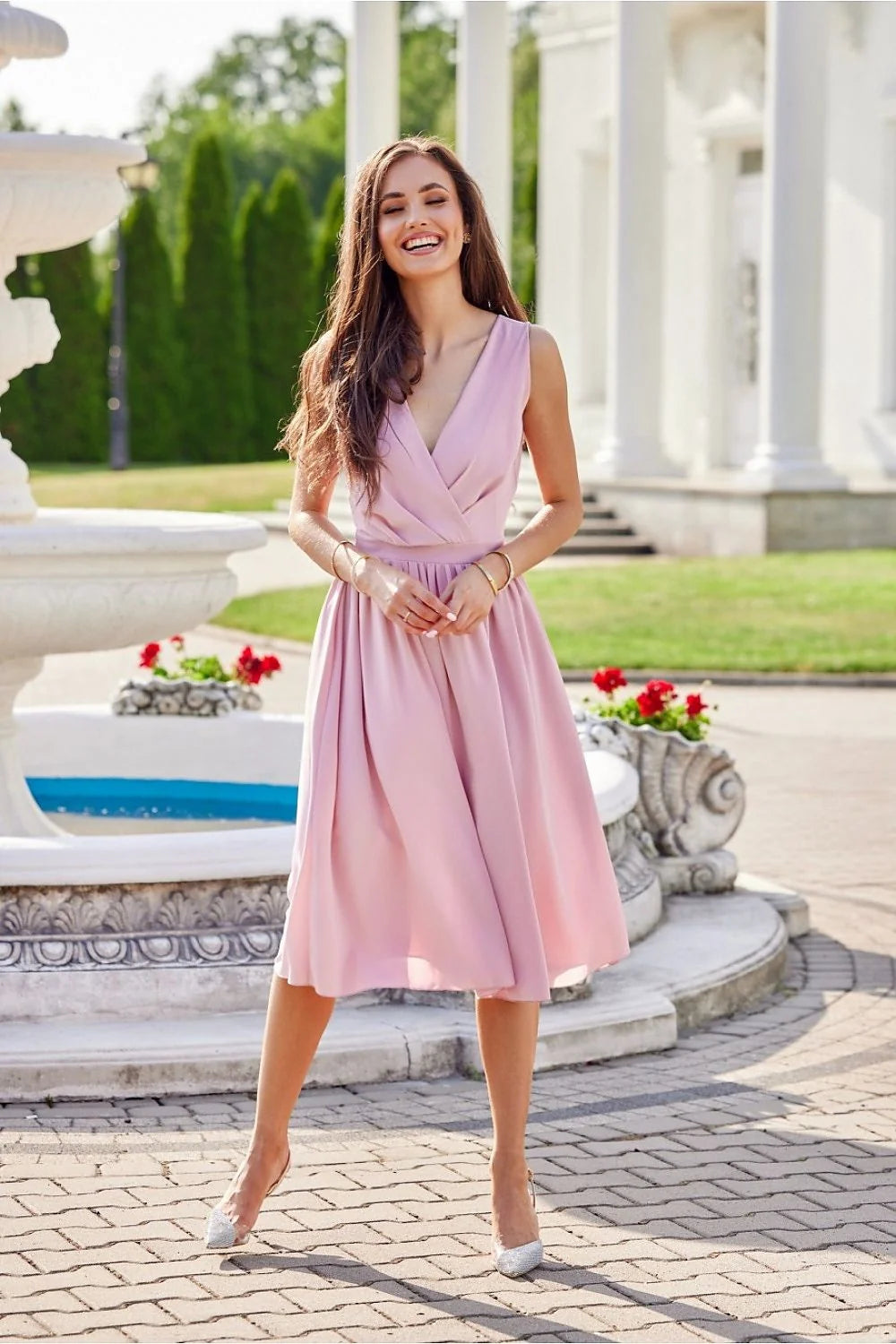 Robe de cocktail élégante cache-cœur sans manches taille cintrée jupe évasée couleur rose pâle polyester 100% femme